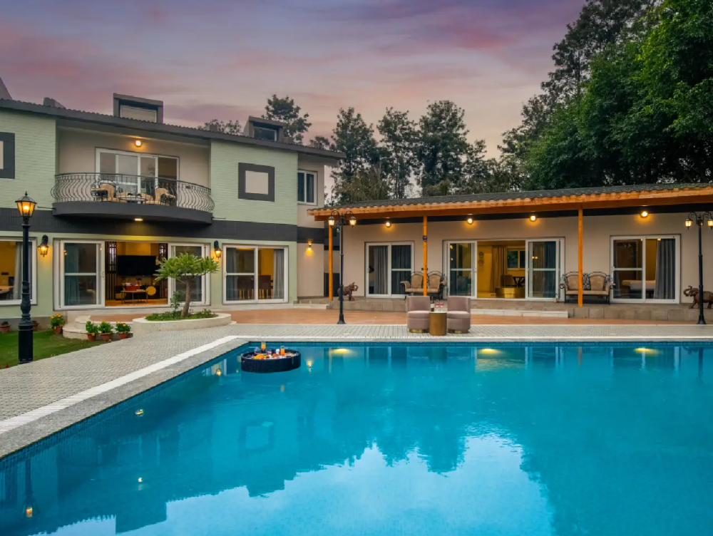 Duplex villa in Manesar with balcony, private pool with floating food tray, and spacious attached side villa lounge