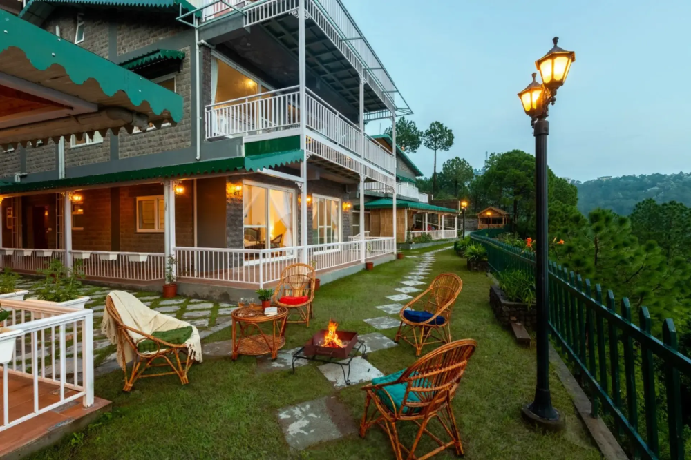 Mountain villa in Kasauli with balcony, front lawn seating, and BBQ area with scenic hill views