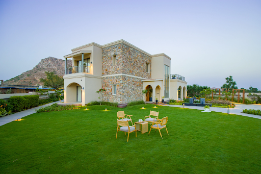 Duplex villa in Jaipur with spacious area, seating arrangement, and scenic Aravali hill views
