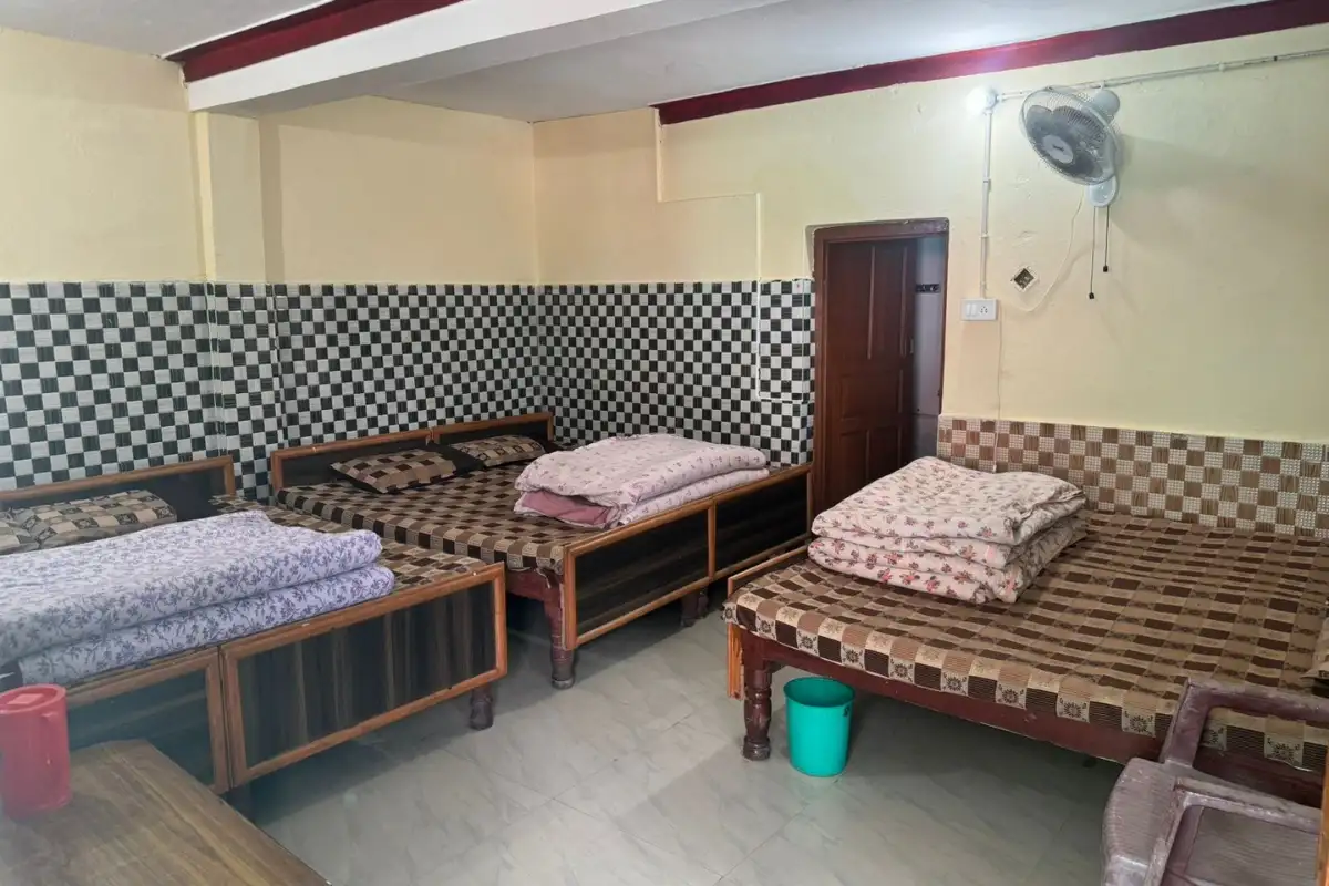 six beds room with fan and attached bathroom at Hotel Sunil Lodge in Gaurikund on Kedarnath Route