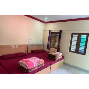 spacious room with window views at Hotel Sunil Lodge in Gaurikund on Kedarnath Route