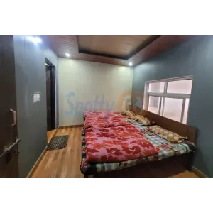 family room with three beds and attached bathroom at Pataliputra House near Kedarnath