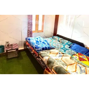 Standard four bed room with two double bed at New Himachal House in Kedarnath
