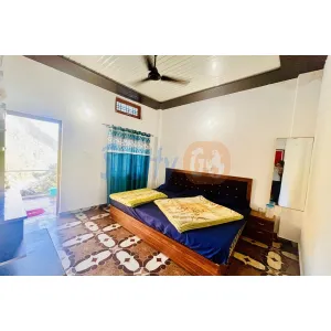 double bed room with balcony at hotel Dev Dham in Rampur, Kedarnath