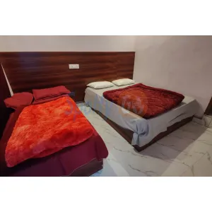 family room with two double beds at Hotel Gaura in Gaurikund on Kedarnath Route