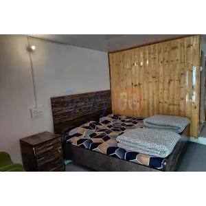 standard room with double bed and attached bathroom at Hotel Kirtilok near Gangotri