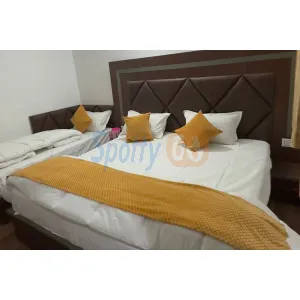 room with three beds at hotel Shri Gangalok in Gangotri