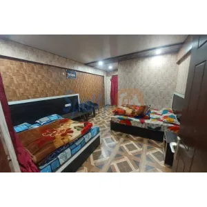 room with double bed and thick blankets at Surya Guest House in Badrinath
