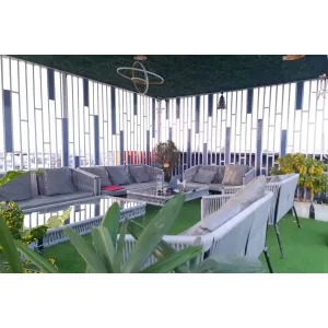 well decorated sitting area with sofa and tables at Hotel Jolly Wings in Dehradun