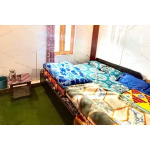 Standard four bed room with two double bed at New Himachal House in Kedarnath