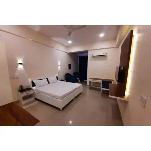 deluxe room with double bed at Shree Sharda Peetham Guest House in Dehradun