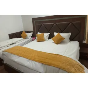 room with three beds at hotel Shri Gangalok in Gangotri