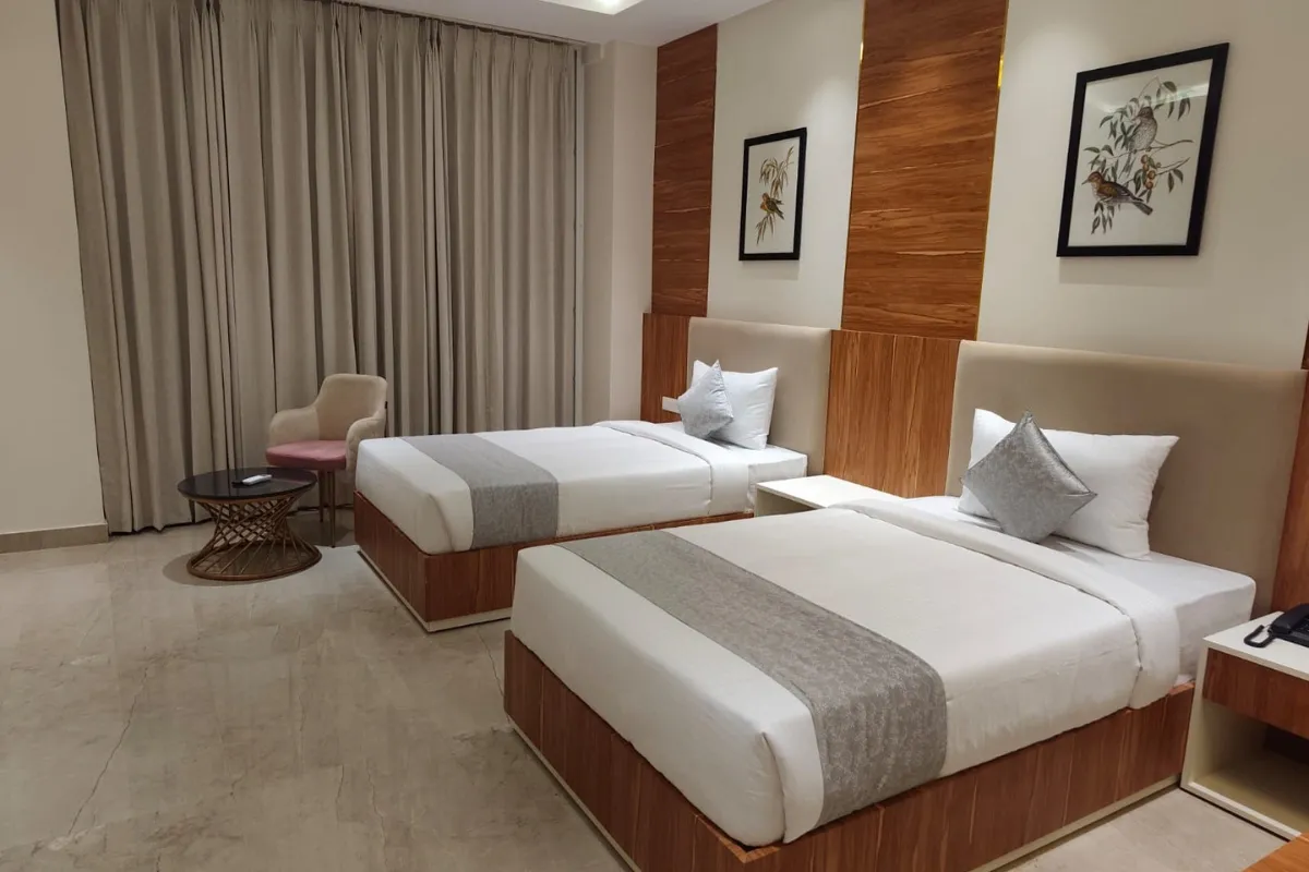 two single bed room at Hotel JJM Palace in Udaipur